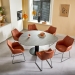 kiq-eetkamerstoelen-op-slede-cognac-leer-steely-xl-eettafel-organische-vorm